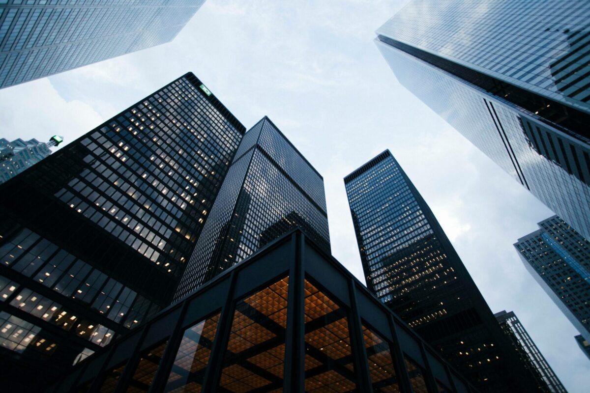 odern high-rise commercial office buildings and premium corporate skyscrapers representing institutional real estate investments.